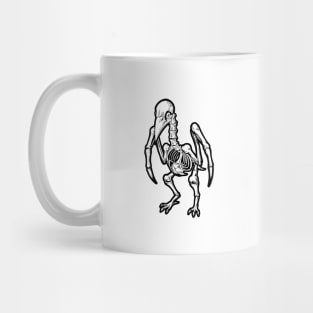 A lone skeleton bird Mug